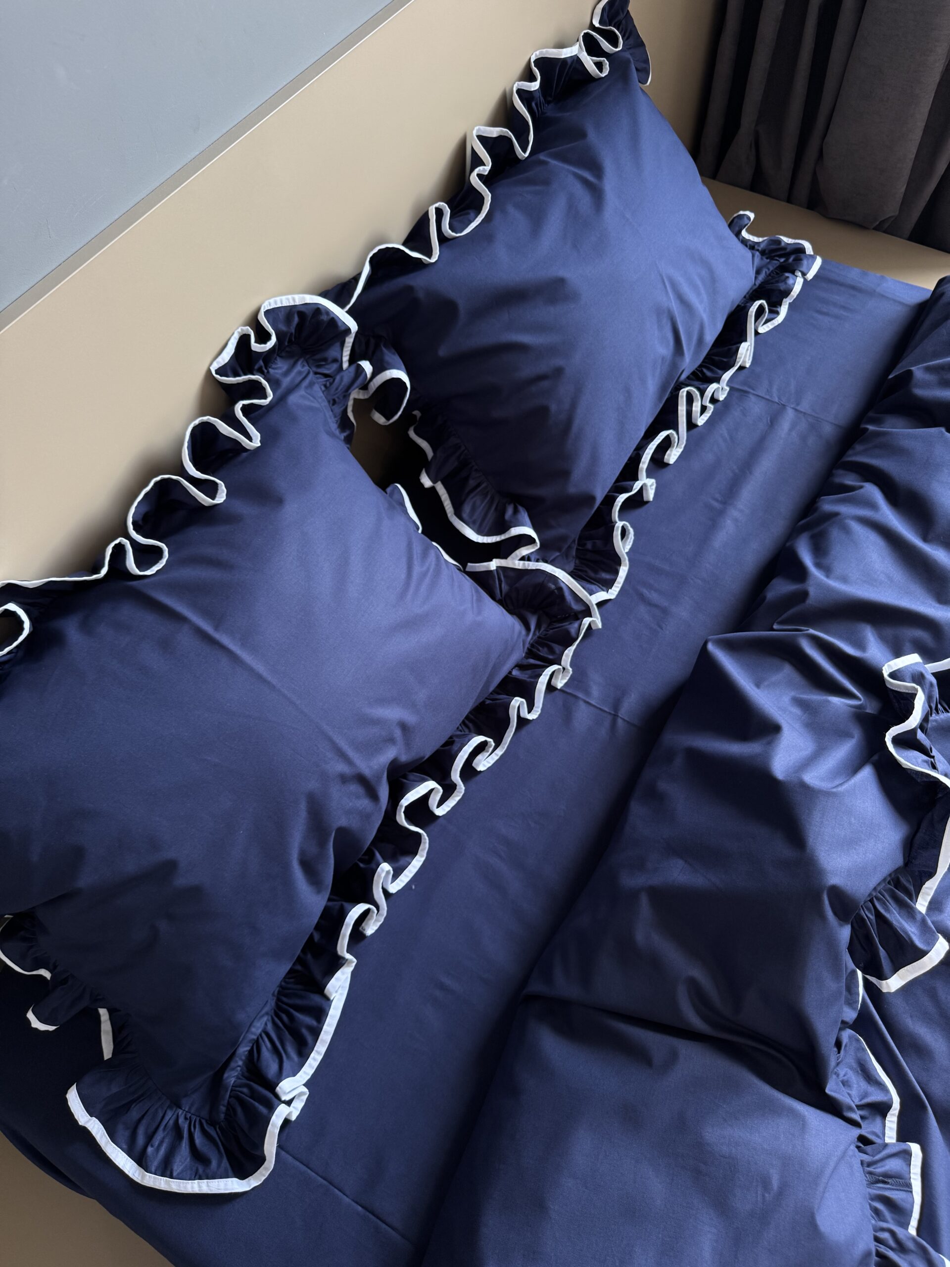 Dark blue with ruffles and trim